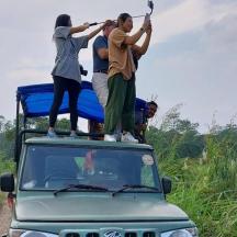 a group of people standing on the roof of a truck