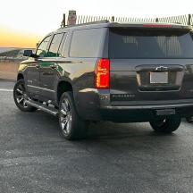 a black suv parked in a parking lot