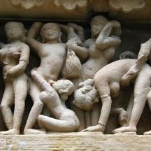 a stone relief of people on a wall