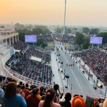 a large crowd of people watching a tennis match