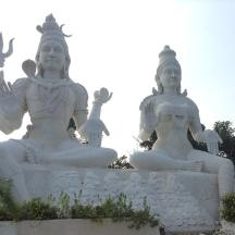 two large white statues sitting next to each other