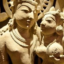 a statue of two women standing next to each other