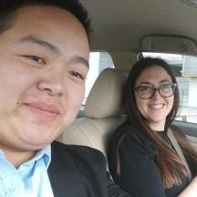 a man and a woman sitting in a car