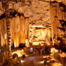 a group of people standing in a cave
