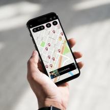 a person holding a cell phone in their hand