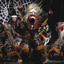 a group of people in costumes on a stage