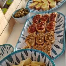 two plates of food on a table with food