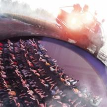 a group of people sitting on a roller coaster