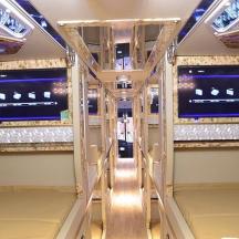 a room with four tiers of shelves in a room