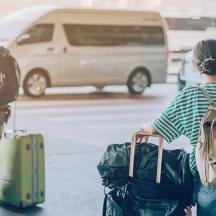 a group of people walking with their luggage