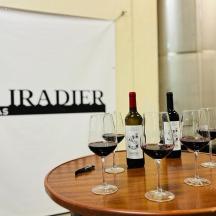 four glasses of wine sitting on a wooden table