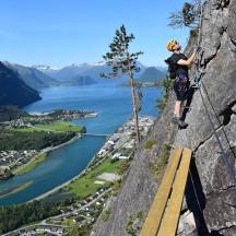 a man standing on a rock cliff