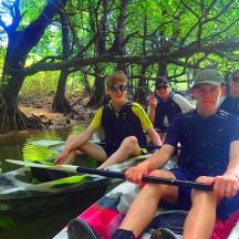 a group of people kayaking on a river