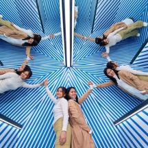 a group of people in a circle in a room
