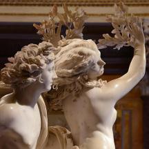 a statue of a woman with her hands in the air
