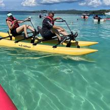 two people on a paddle board in the water