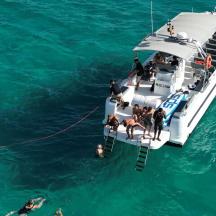a group of people on a boat in the water