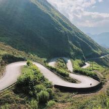 a winding road on the side of a mountain