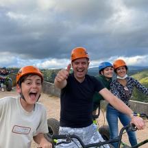 a group of people wearing helmets on their bikes