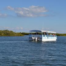 a boat with people on it on the water