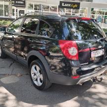 a black car parked in a parking lot