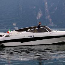 a man in a white boat on the water
