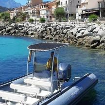 a man is sitting on a boat in the water