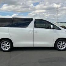 a white van parked next to the water