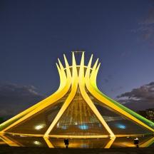 a pyramid shaped building with lights on it at night