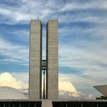 a building with two tall towers in front of a sky