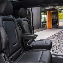 an open back seat of a van with the door open