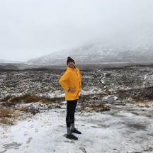 a person standing in a snow covered field