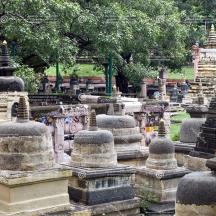 a bunch of stone structures in a cemetery