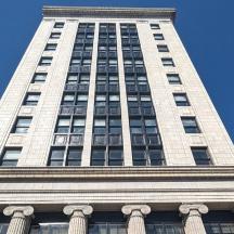 a tall white building with a lot of windows