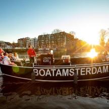a group of people on a boat in the water