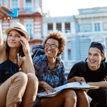 a group of three people sitting next to each other