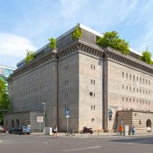 a large stone building on a city street
