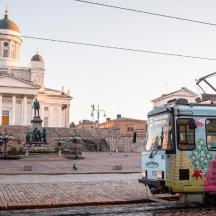 a trolley car in front of a building