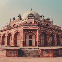 a large brick building with a dome on top