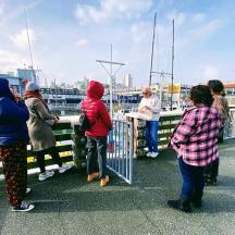 a group of people standing on a bridge