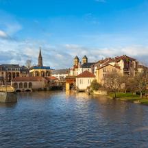 a view of a city with a river and buildings