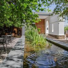 a koi pond in the courtyard of a restaurant