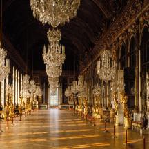 a large room with chandeliers in a building