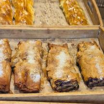 a plastic container filled with pastries and other food
