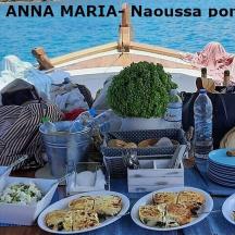 a table with plates of food on a boat