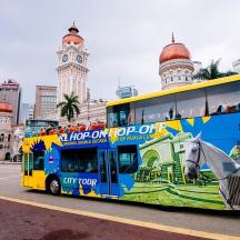 a double decker bus parked in front of a building