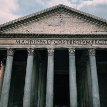 a large building with pillars in front of it