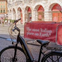 a bike parked on a street with a sign on it