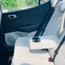 an open back seat of a car with the door open