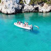a group of people on a boat in the water